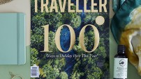 flat lay showing front cover of Australian Traveller magazine with top 100 trips