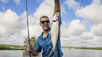 Man holding fish that he caught