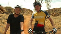 Two people riding bikes in the NT