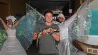 Man holding a baby crocodile