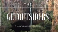 image of white text that reads THE GET OUTSIDERS on top of image of waterfall