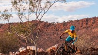 man riding mountain bike trail