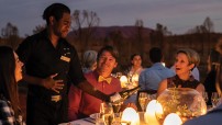 image of outdoor diners being served by waiter in Uluru 