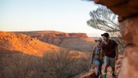 image of woman and man hiking with rocks