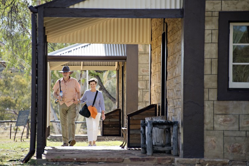 Couple walking towards Alice Springs Telegraph Station