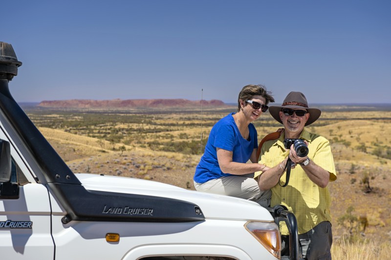 Couple sitting on landcruiser