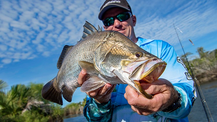 Fisherman holding fish