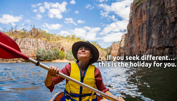 Girl kayaking along Nitmiluk Gorge in the Katherine region