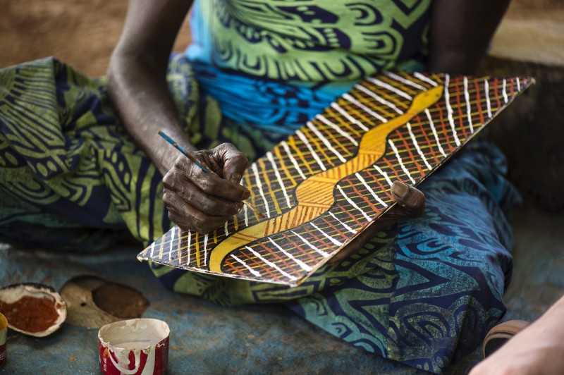 image of womans hand doing a bark painting